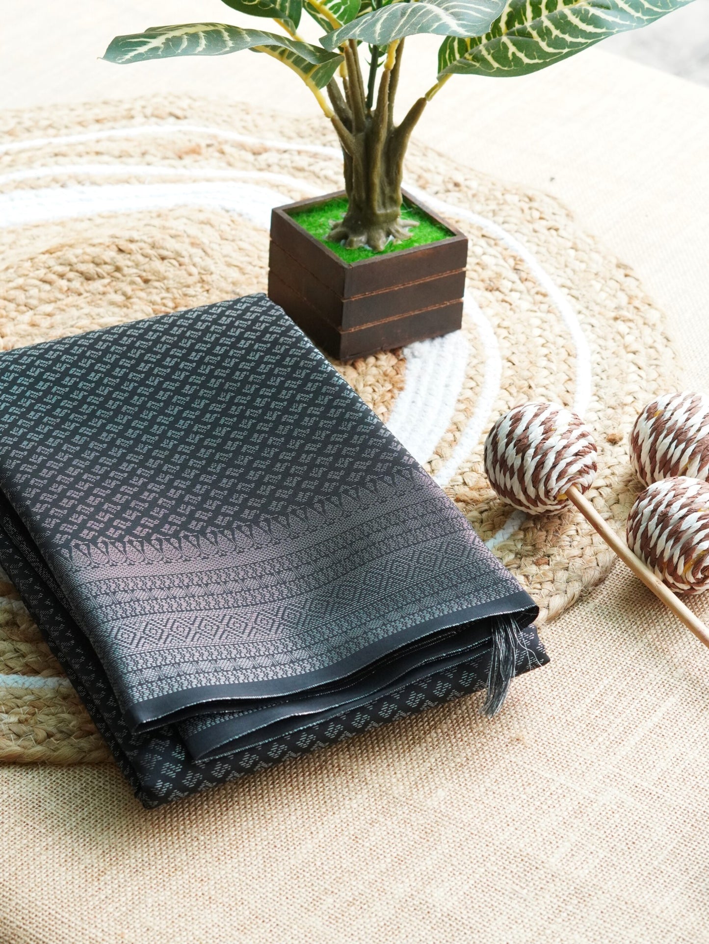 black semi-silk saree with silver zari