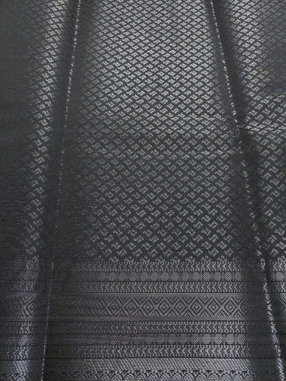 black semi-silk saree with silver zari