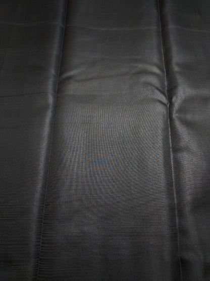 black semi-silk saree with silver zari